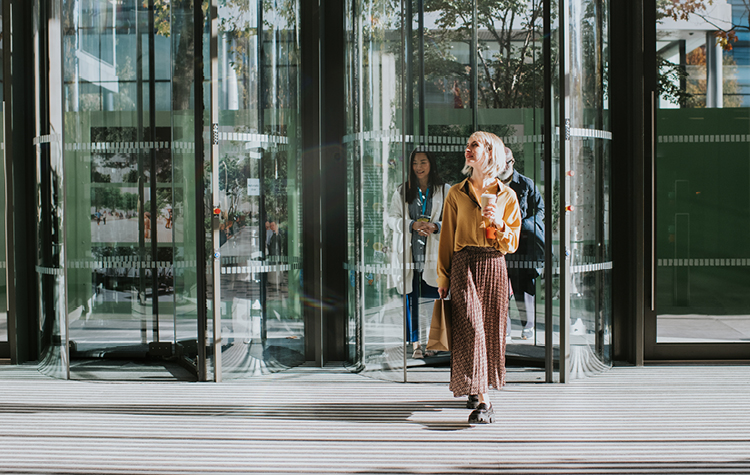 Female leader leaves an office building